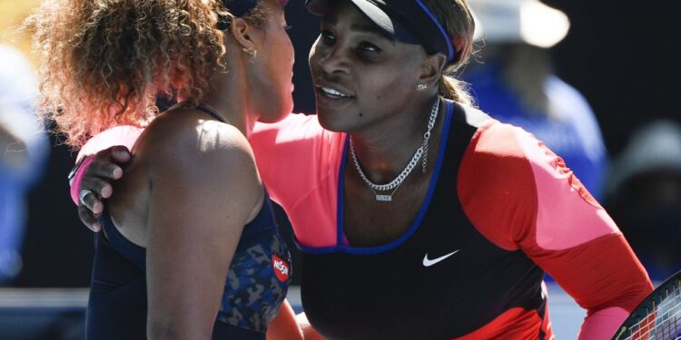 Japan's Naomi Osaka, left, is congratulated by United States' Serena Williams after winning their semifinal match at the Australian Open tennis championship in Melbourne, Australia, Thursday, Feb. 18, 2021.(AP Photo/Andy Brownbill)